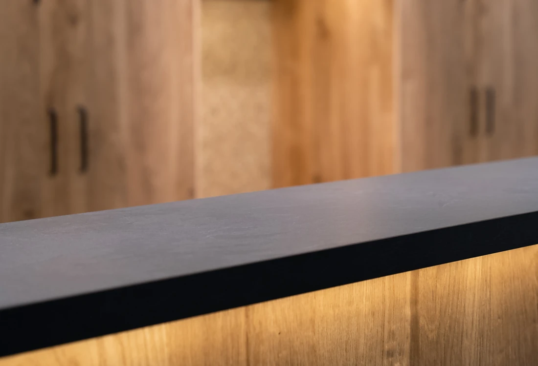 <p><span>Soft, warm light from off stage: Loox 5 LED light strips have been invisibly integrated underneath the counter and enhance the elegant appearance of the natural-looking wooden front. Photo: Lechtaler Dirndl &amp; Tracht GmbH &amp; Co. KG</span><span></span></p>