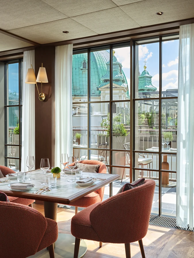 <p><span>St Peter&rsquo;s Cathedral is right next door &ndash; even at Brasserie Neue Hoheit, on the hotel&rsquo;s top floor. Guests can enjoy exclusive seasonal and regional cuisine with a stunning view.</span><span> </span><span>Photo: Rosewood Vienna</span><span></span></p>