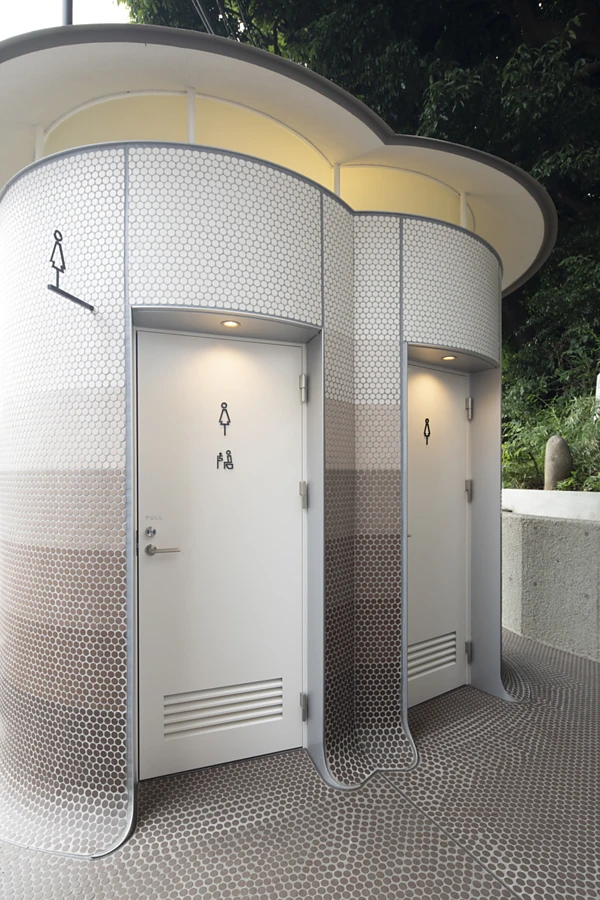 <p>The exterior walls of the &ldquo;three mushrooms&rdquo; were covered with custom self-cleaning mosaic tiles, the colour creating a gradient effect from earthy dark brown at the bottom to a lighter shade at the top. Photo: TOTO LTD.</p>